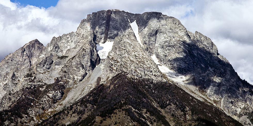 Mt. Moran: Precambrian metamorphic granite and gneiss bisected by a black diabase dike, capped by sandstone.