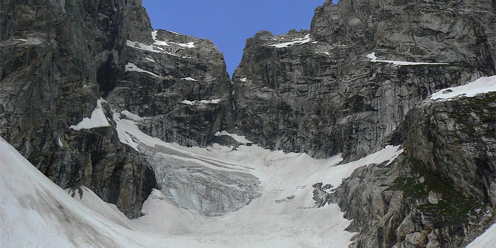 The Teton Glacier clings to the high valley of Glacier Gulch between the Grand Teton and Mount Owen.