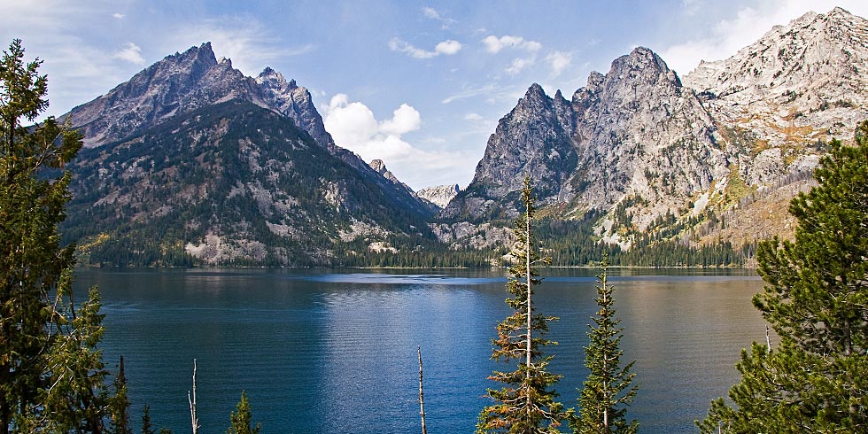 The Cathedral Group towers above Jenny Lake, nestled at the mouth of the glacially carved Cascade Canyon.